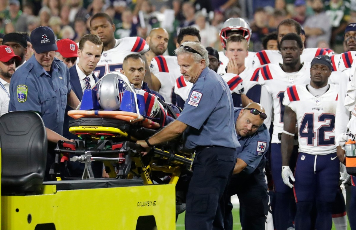 Teammates look on as New England Patriots cornerback Isaiah Bolden (7) is taken off the field on a stretcher after a fourth quarter injury against the Green Bay Packers Saturday, (Dan Powers/USA TODAY Sports)